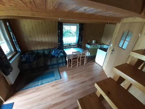 an overhead view of a living room and kitchen in a log cabin at Siedlisko Bieszczadzkie 1 in Lutowiska