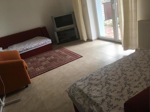 Postel nebo postele na pokoji v ubytování Penzion Jozef
