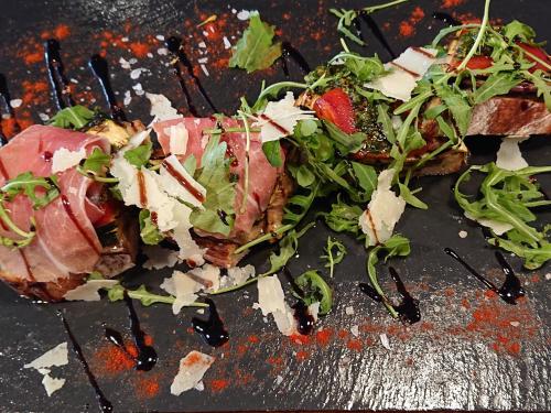 a sandwich with meat and salad on a table at Hôtel-Restaurant Le Lion d'Or in Porrentruy