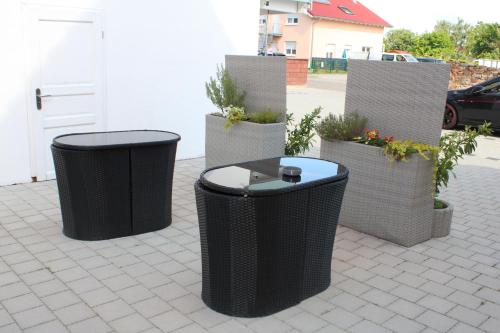 a group of three trash cans on a patio at Ferienwohnung Misita in Rust