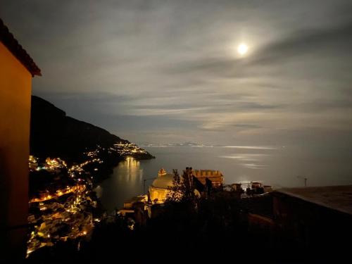 a view of a body of water at night at Casa Positamo in Positano