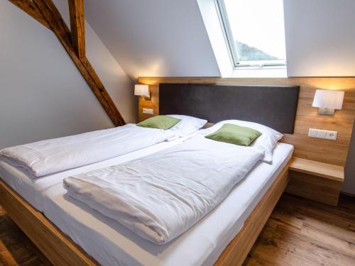 Postel nebo postele na pokoji v ubytování Restaurant & Appartements In Vino Veritas