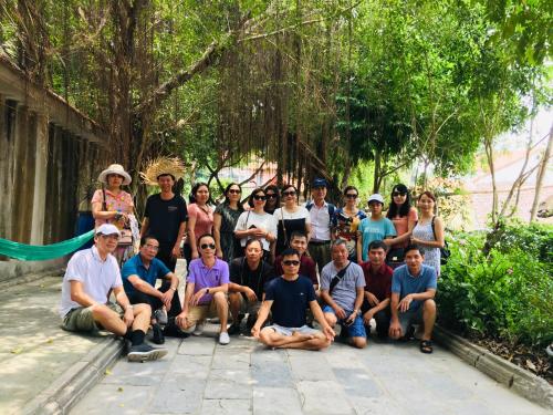 a group of people posing for a picture at Tam Coc Friendly Homestay in Ninh Binh