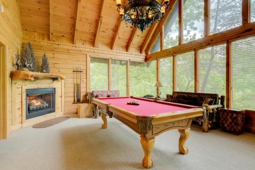 a pool table in a room with a fireplace at Bear Necessities #71 in Sevierville