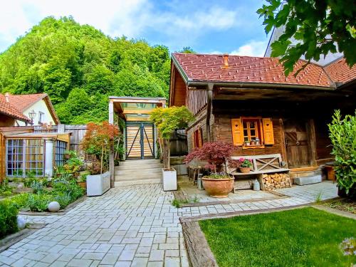 a house with a pathway leading to the front yard at ABC apartments in Kamnik