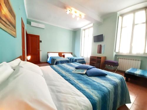 Postel nebo postele na pokoji v ubytování Hotel Alba Torino centro