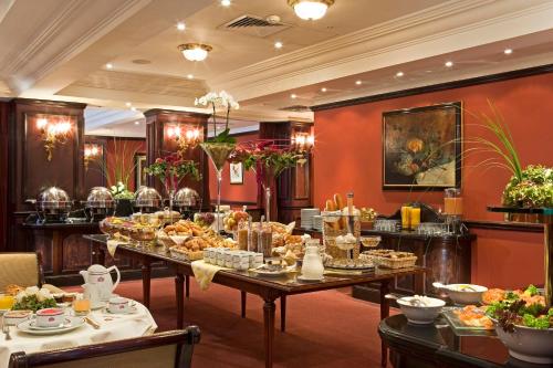 a buffet line of food in a hotel room at Warwick Grand-Place Brussels in Brussels