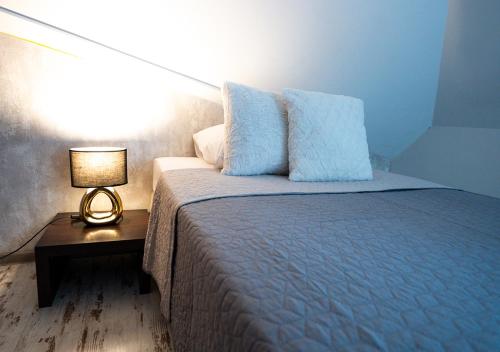 
Ein Bett oder Betten in einem Zimmer der Unterkunft Penzion Pri Parku

