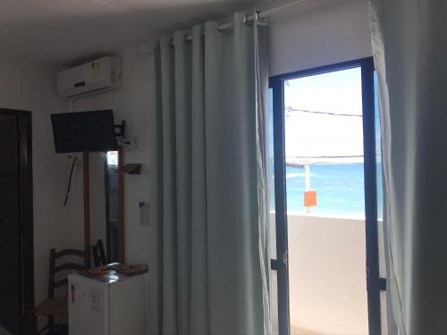 TV a/nebo společenská místnost v ubytování Pousada Mar Aberto