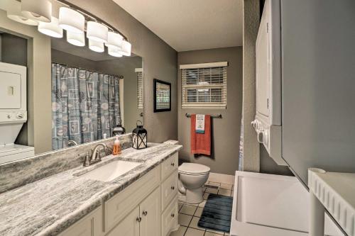 a bathroom with a sink and a toilet and a mirror at 7 Mi to Natl Park Home with Dock in Hot Springs in Hot Springs