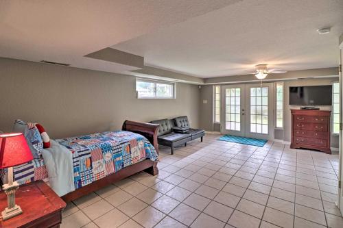 a bedroom with a bed and a living room at 7 Mi to Natl Park Home with Dock in Hot Springs in Hot Springs