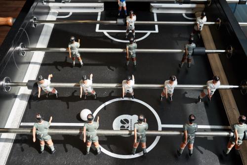 an overhead view of a group of people in military uniforms at EVEN Hotel New York - Times Square South by IHG in New York