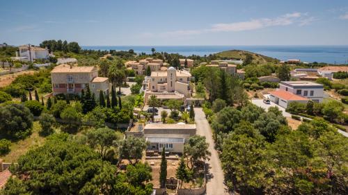 an aerial view of a large house with trees at Quinta da Liberdade in Luz