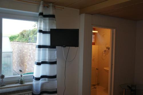 TV a/nebo společenská místnost v ubytování Ferienwohnung in der Rhön