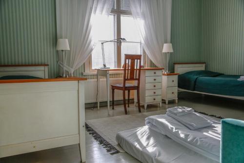 Ένα ή περισσότερα κρεβάτια σε δωμάτιο στο Tehtaan Hotelli