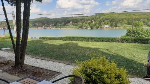 a view of a lake from a park at Onix - Orfű Apartman in Orfű