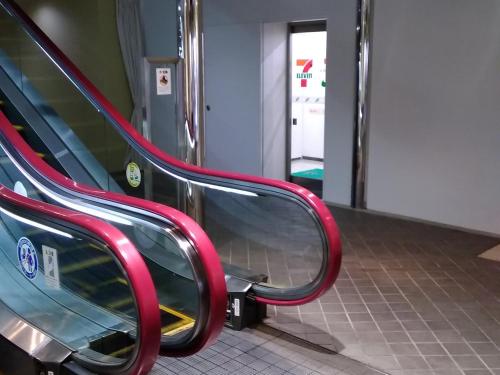 an empty escalator on a subway train at Grand Hotel Kanachu Hadano in Hadano