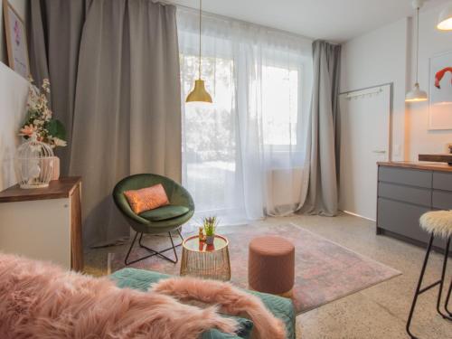 a living room with a couch and a chair at Nikolai Homes in Vienna