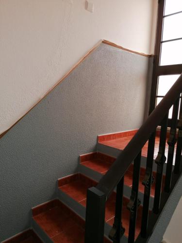 a set of stairs in a house at Maré Beach in Monte Gordo