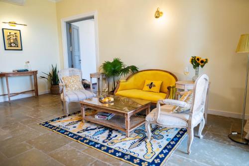 a living room with a table and chairs at The Source At Sula in Nashik