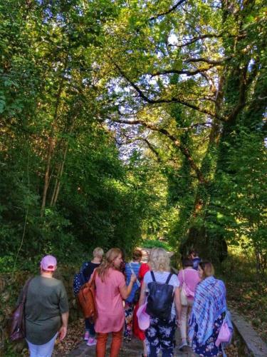 a group of people walking down a trail at Le Vie Mediterranee in Torre di Ruggiero
