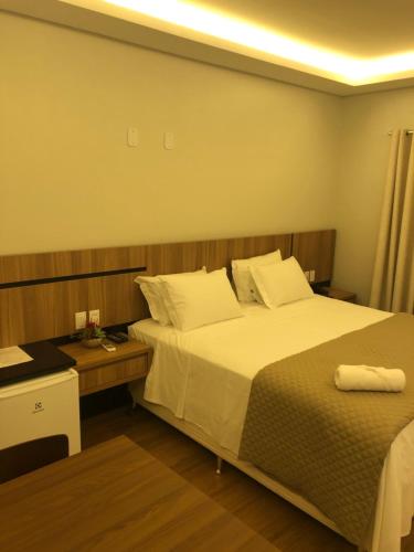 Ένα ή περισσότερα κρεβάτια σε δωμάτιο στο HOTEL ROYAL AMAMBAI