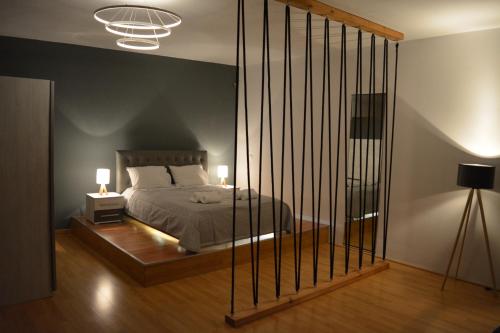 A bed or beds in a room at Cinema Zeus Studios - by Avelink