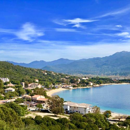 a town on the shore of a body of water at Les Villas MarInCelu in Porto Pollo
