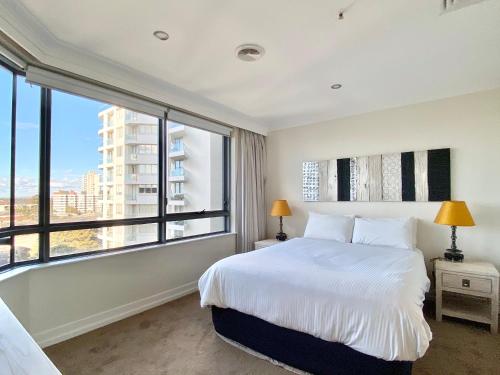 Letto o letti in una camera di Milson Serviced Apartments
