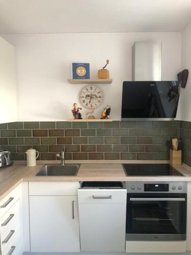 a kitchen with a sink and a counter top at FeWo Inge Reiter in Braunlage