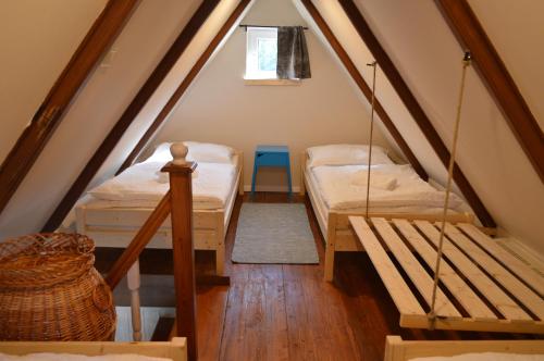 מיטה או מיטות בחדר ב-Intertranscoop Lake House