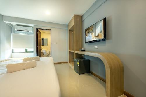 Ένα ή περισσότερα κρεβάτια σε δωμάτιο στο PLAAI Play Hotel