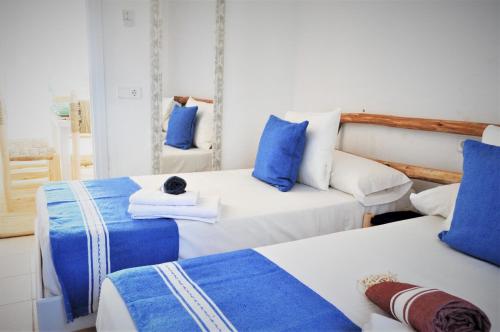 En eller flere senge i et værelse på Siamoformentera Villa Antonella