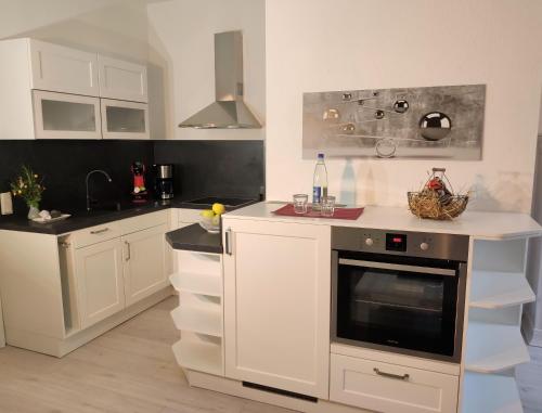 Η κουζίνα ή μικρή κουζίνα στο Ferienwohnung Bastei