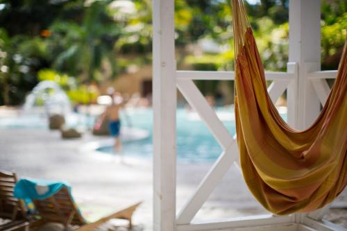 a view of a swimming pool from a hammock at Tropical Islands in Krausnick
