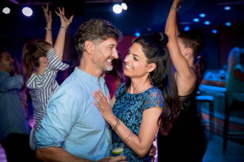 a man and a woman dancing at a party at ROBINSON AGADIR - All Inclusive in Agadir
