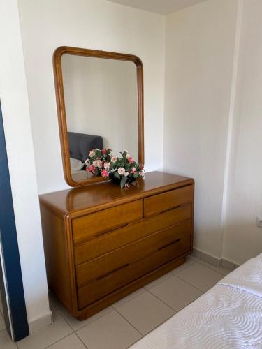 a dresser with a mirror on top of it at Stella Maisonette Hanioti in Hanioti