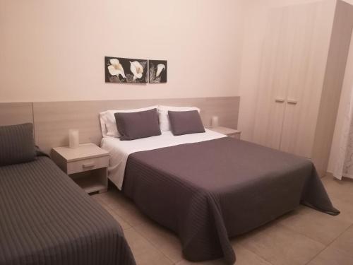Ένα ή περισσότερα κρεβάτια σε δωμάτιο στο Casa Vacanze Bella Giulia