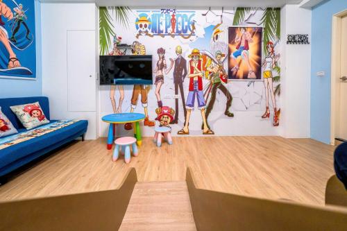 a living room with a blue couch and some figurines at Han Tian Slide in Wujie