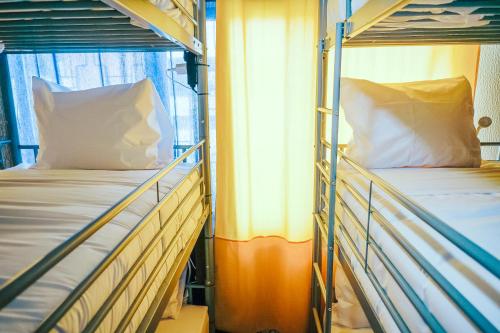 two bunk beds on a cruise ship at Help Yourself Hostels - Restelo in Lisbon