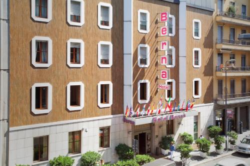 a building with a sign on the side of it at Hotel Berna in Milan