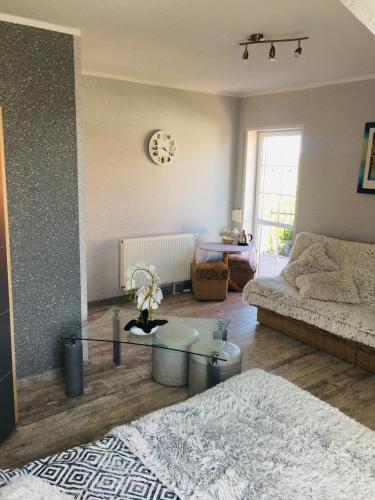 a living room with a couch and a table at U Wróbelka in Grzybowo