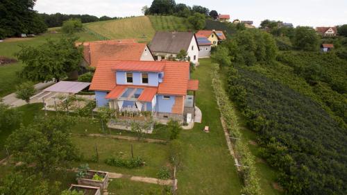 an aerial view of a house with an orange roof at Ferienhaus Ulrichsbrunn in Hartmannsdorf