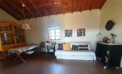 a bedroom with a bed and a table in it at Monte da Clareira - Comporta Carvalhal Melides in Grândola