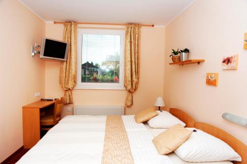 Postel nebo postele na pokoji v ubytování Guest House Pri Gondoli