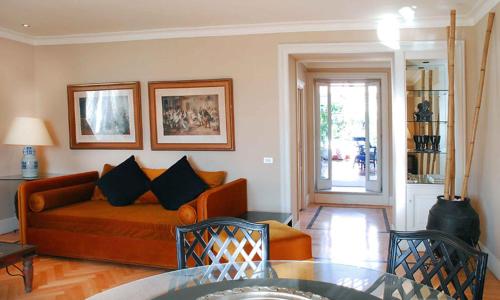 a living room with a couch and a glass table at Casa Rubinacci in Naples