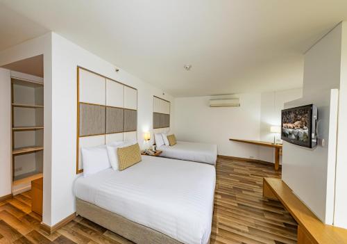 Cama o camas de una habitación en Cosmos Hotel - Cali