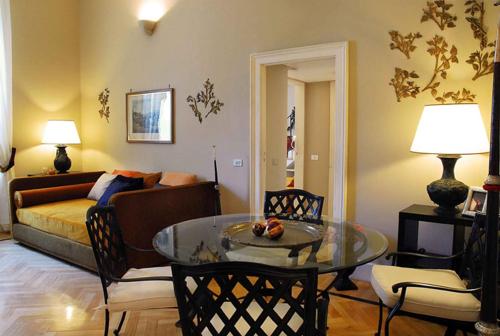 a living room with a couch and a table at Casa Rubinacci in Naples
