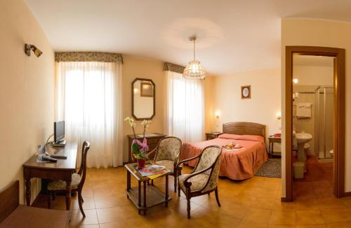 Postel nebo postele na pokoji v ubytování Hotel Ristorante Combolo