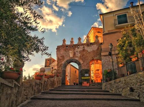 an entrance to a building with a stone archway at Panoramic Apartments in Villa in Center "The Beach and The Cliff" 1 in Agropoli
